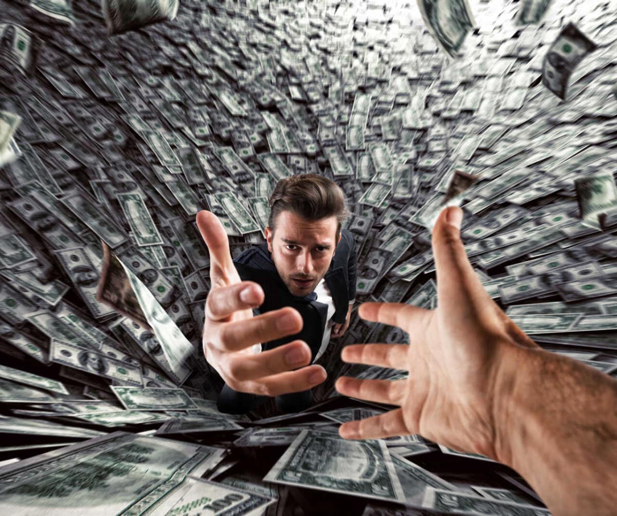 Businessman,swallowed,by,a,black,hole,of,money,needs,help.